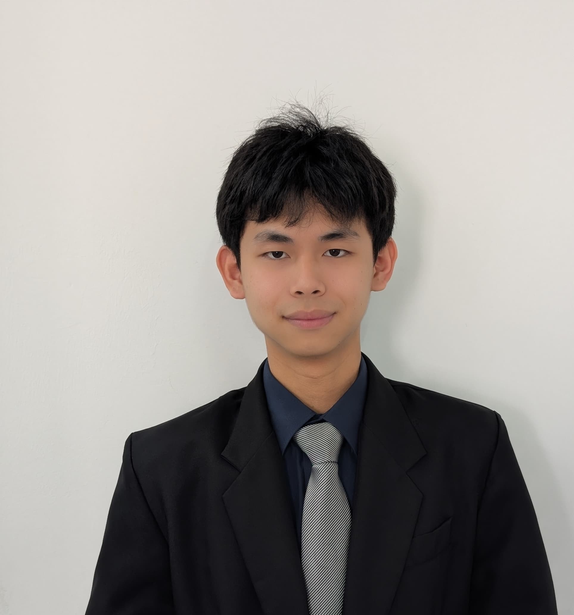 Looi Yong Hang wearing a dark suit
